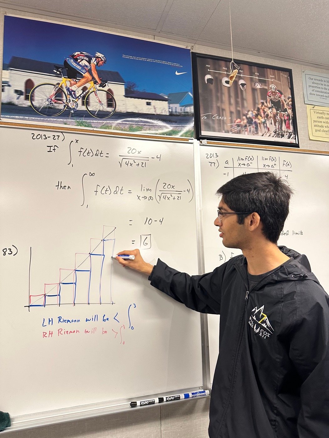 R.C. Napkin working through a calculus problem on a classroom whiteboard